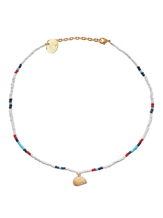 Fun and delicate, this one-string beaded choker showcases a beautiful sea shell from French Polynesia. Shells are thought to carry calming, healing energies and are linked to Aphrodite, the Greek goddess of love.