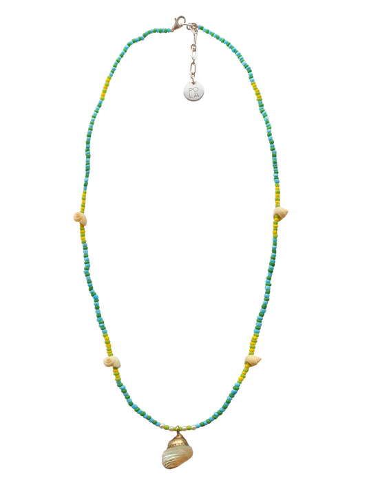 Delicately crafted, this one-string beaded necklace features a stunning antique iridiscent Turbo Shell. Historically known to bring good fortune, sucess, and wealth. 