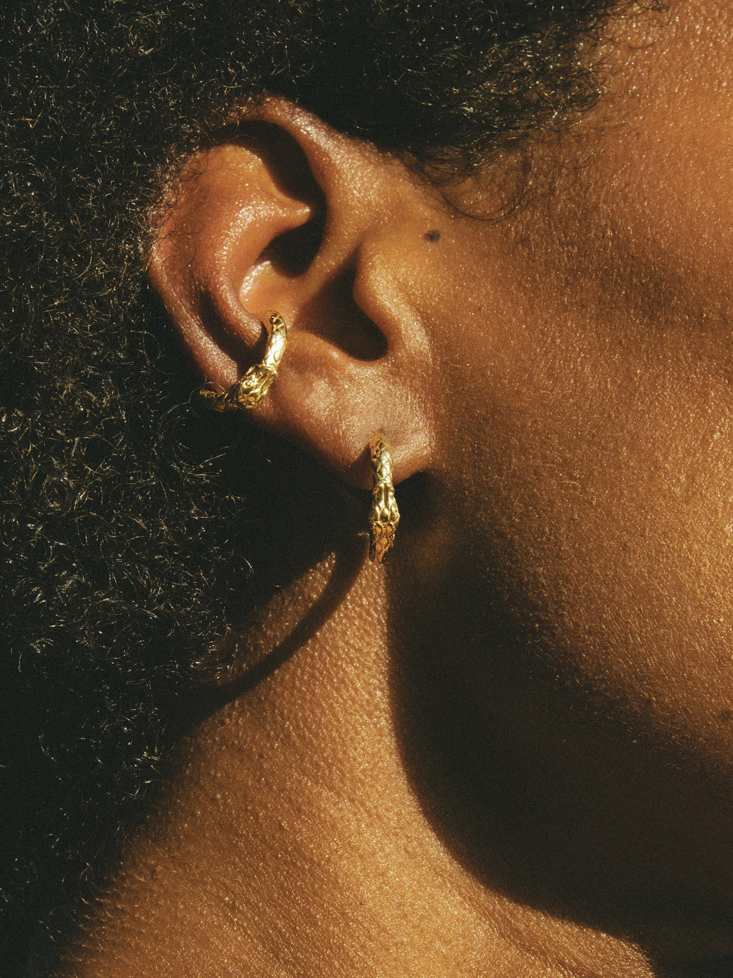 Ouroboros Mini Hoop Earrings. Inspired by the mythic Ouroboros, these earrings symbolize Eternal Love and Infinite Power. Gold plated Sterling Silver. Gender Neutral